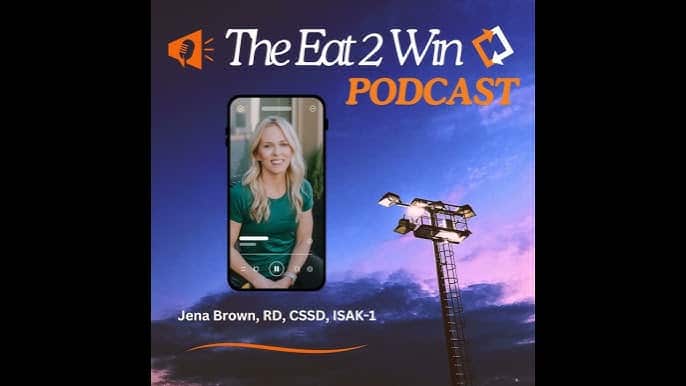 Podcast cover graphic for The Eat 2 Win Podcast featuring a photo of a smiling woman with long blonde hair wearing a green top, displayed inside a smartphone frame. The background shows a dark sky with stadium lights. Text on the graphic reads ‘The Eat 2 Win Podcast’ and ‘Jena Brown, RD, CSSD, ISAK-1.’